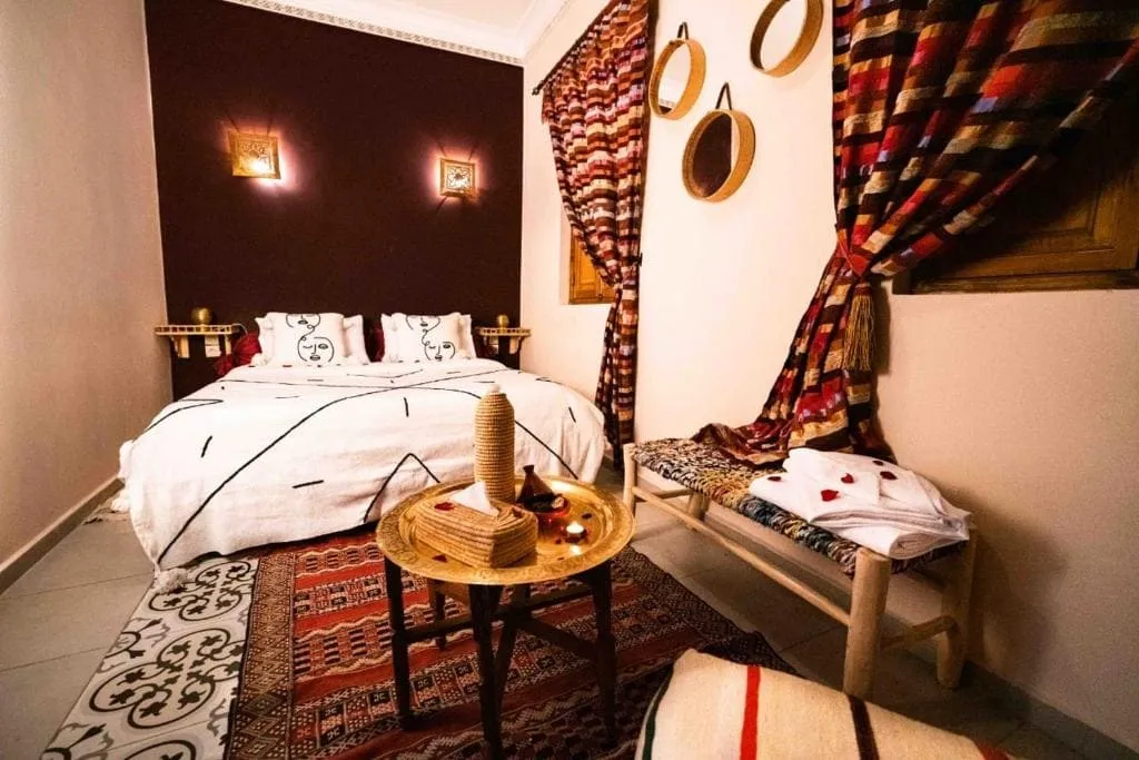Charming bedroom at Riad Kiyanjana Marrakech with Moroccan decor.