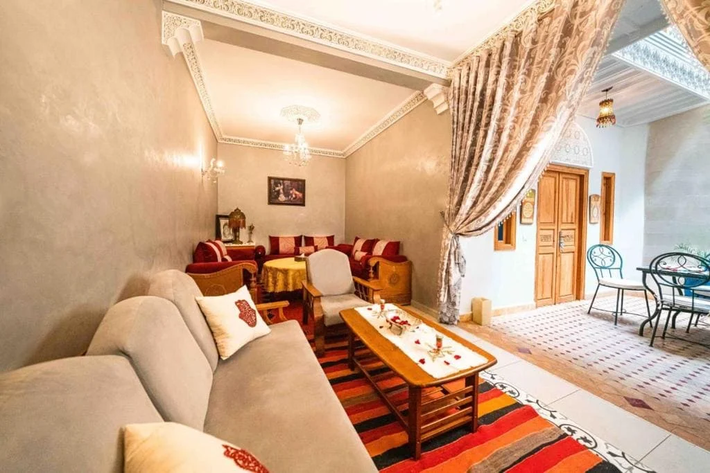 Cozy lounge with traditional Moroccan decor and comfortable seating.