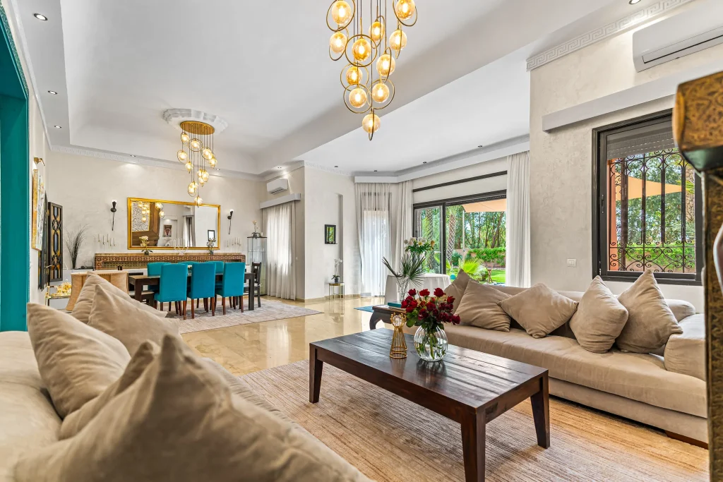 Spacious living room with modern decor and large windows.